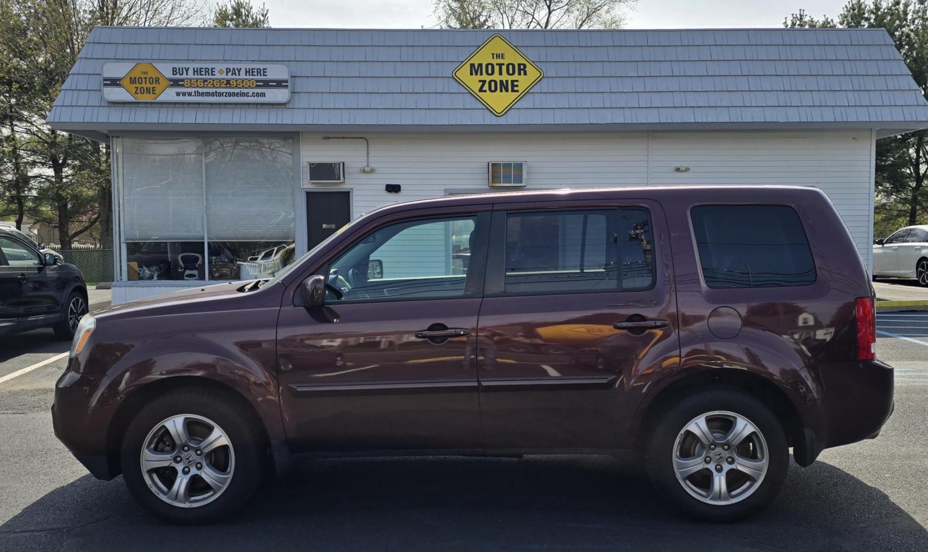 2013 Red Honda Pilot (5FNYF4H50DB) with an V6, i-VTEC, 3.5 Liter engine, Automatic, 5-Spd transmission, located at 1010 N White Horse Pike, Stratford, NJ, 08084, (856) 262-9500, 39.838921, -75.011497 - Photo#2