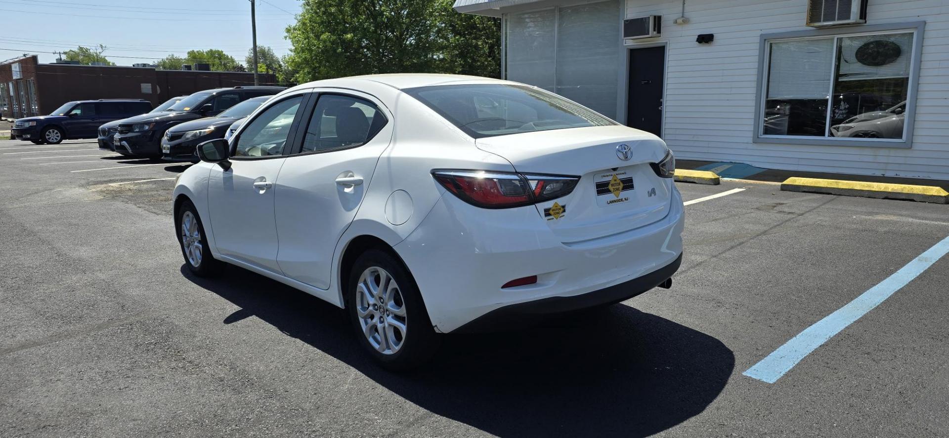 2018 White /Black Toyota Yaris iA 6A (3MYDLBYV7JY) with an 1.5L L4 DOHC 16V engine, 6A transmission, located at 1010 N White Horse Pike, Stratford, NJ, 08084, (856) 262-9500, 39.838921, -75.011497 - Photo#2
