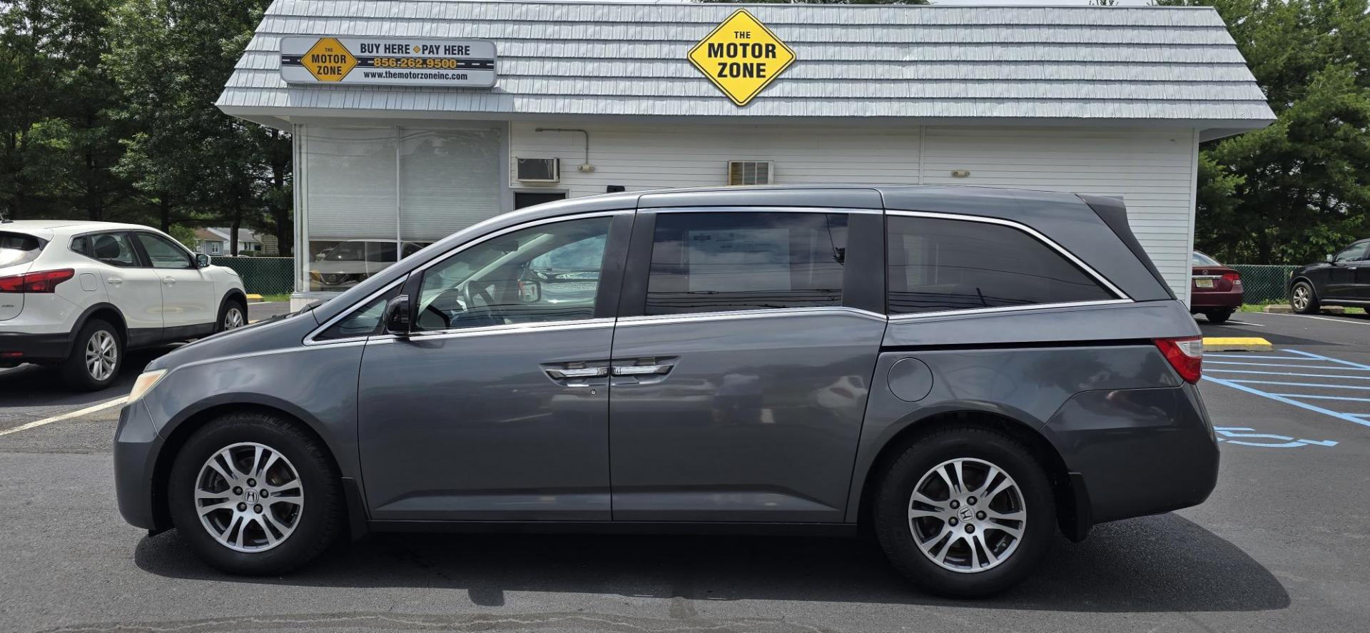 2013 Gray /Silver Honda Odyssey EX (5FNRL5H44DB) with an 3.5L V6 SOHC 24V engine, 5-Speed Automatic transmission, located at 1010 N White Horse Pike, Stratford, NJ, 08084, (856) 262-9500, 39.838921, -75.011497 - If an SUV is just too big and too fuel-thirsty, the 2013 Honda Odyssey is your next best bet. It’s EPA-rated at 28 mpg on the highway, has a stylish and modern exterior and lots of room for kids and cargo; it’s one of the best bargains on the market. No one lusts after minivans. They are ofte - Photo#4
