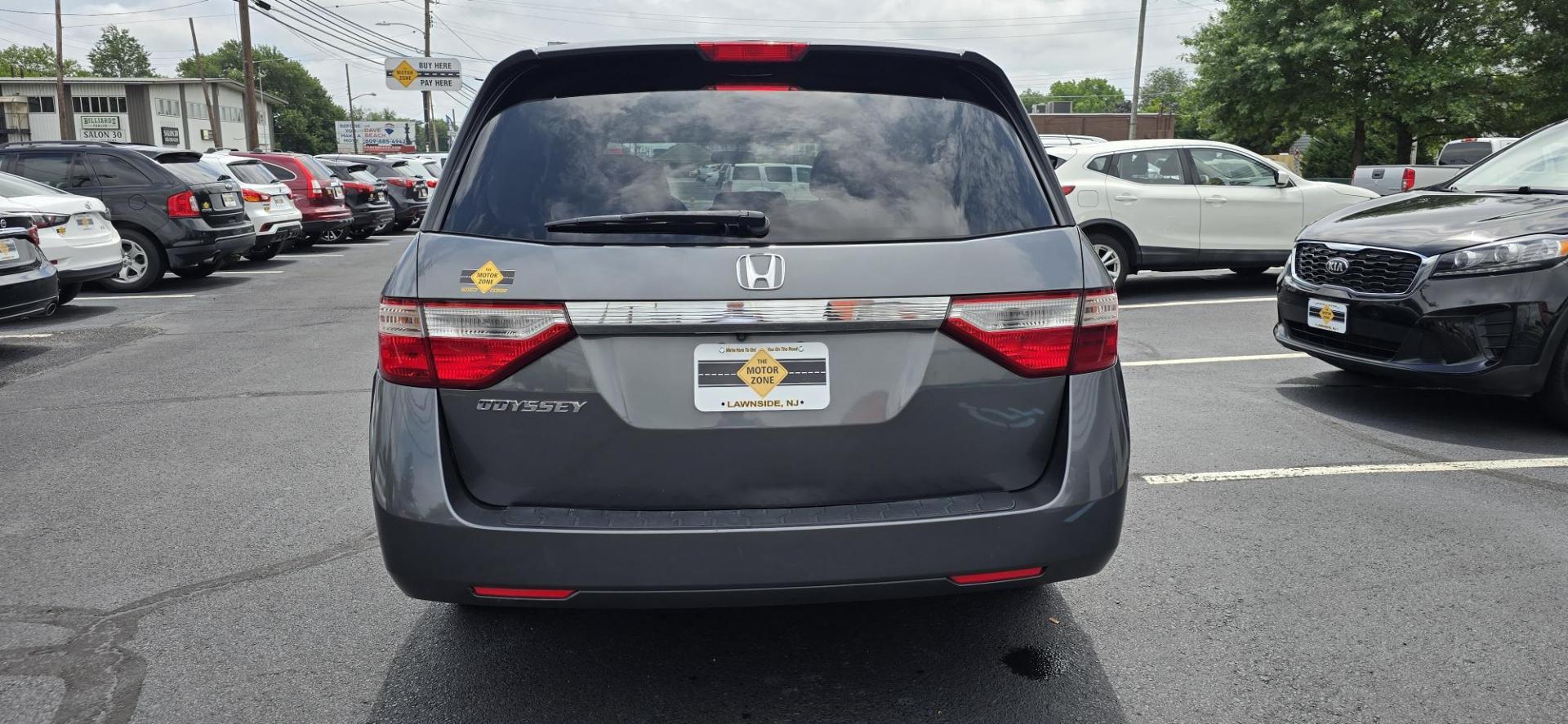2013 Gray /Silver Honda Odyssey EX (5FNRL5H44DB) with an 3.5L V6 SOHC 24V engine, 5-Speed Automatic transmission, located at 1010 N White Horse Pike, Stratford, NJ, 08084, (856) 262-9500, 39.838921, -75.011497 - If an SUV is just too big and too fuel-thirsty, the 2013 Honda Odyssey is your next best bet. It’s EPA-rated at 28 mpg on the highway, has a stylish and modern exterior and lots of room for kids and cargo; it’s one of the best bargains on the market. No one lusts after minivans. They are ofte - Photo#3
