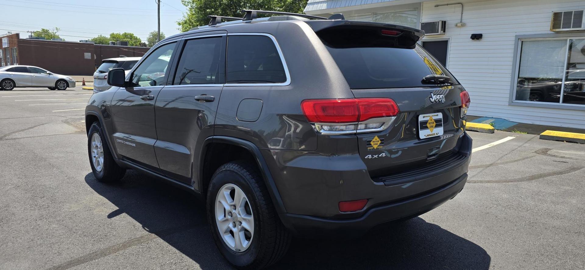 2014 Gray /Black Jeep Grand Cherokee Laredo 4WD (1C4RJFAG2EC) with an 3.6L V6 DOHC 24V engine, 5-Speed Automatic transmission, located at 1010 N White Horse Pike, Stratford, NJ, 08084, (856) 262-9500, 39.838921, -75.011497 - If you want a midsize SUV that does a little of everything, the 2014 Jeep Grand Cherokee is tough to beat. Its well-trimmed cabin is comfy for five, and it's one of the few remaining utility vehicles that can handle both off-road trails and daily commutes. If you haven't been around a new Grand C - Photo#2