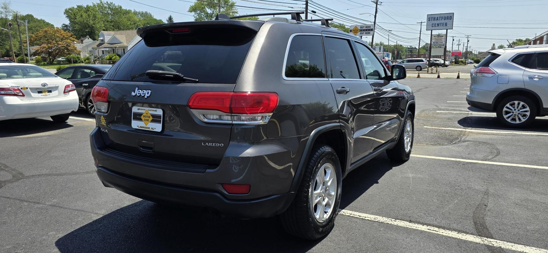 2014 Gray /Black Jeep Grand Cherokee Laredo 4WD (1C4RJFAG2EC) with an 3.6L V6 DOHC 24V engine, 5-Speed Automatic transmission, located at 1010 N White Horse Pike, Stratford, NJ, 08084, (856) 262-9500, 39.838921, -75.011497 - If you want a midsize SUV that does a little of everything, the 2014 Jeep Grand Cherokee is tough to beat. Its well-trimmed cabin is comfy for five, and it's one of the few remaining utility vehicles that can handle both off-road trails and daily commutes. If you haven't been around a new Grand C - Photo#3