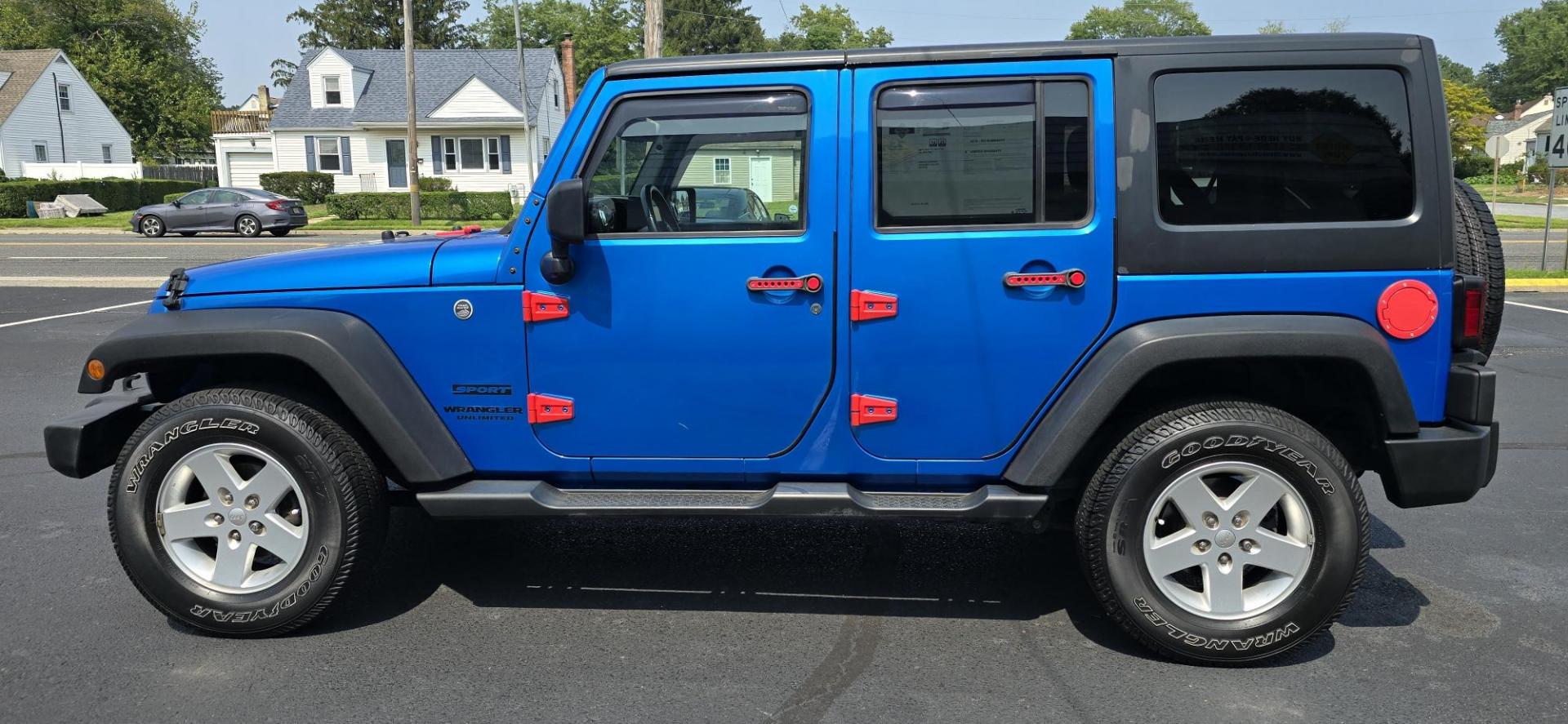 2016 Blue /Charcoal Jeep Wrangler Unlimited Sport 4WD (1C4BJWDG3GL) with an 3.6L V6 DOHC 24V FFV engine, 5-Speed Automatic transmission, located at 1010 N White Horse Pike, Stratford, NJ, 08084, (856) 262-9500, 39.838921, -75.011497 - Photo#6