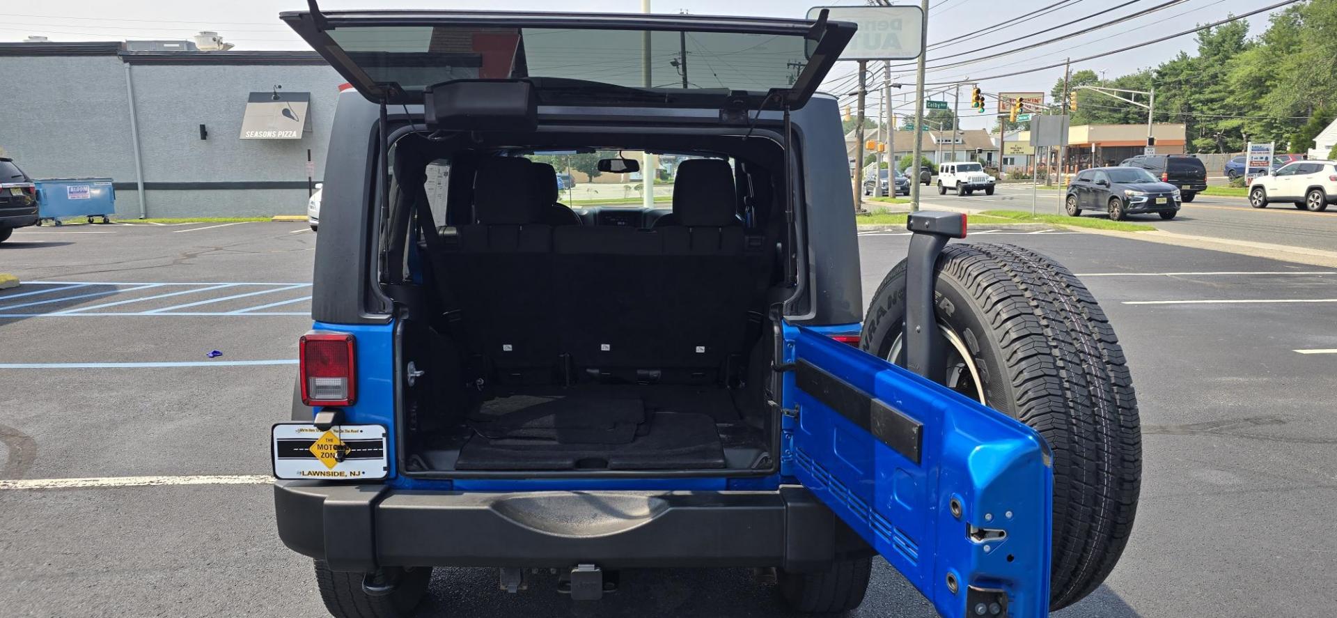 2016 Blue /Charcoal Jeep Wrangler Unlimited Sport 4WD (1C4BJWDG3GL) with an 3.6L V6 DOHC 24V FFV engine, 5-Speed Automatic transmission, located at 1010 N White Horse Pike, Stratford, NJ, 08084, (856) 262-9500, 39.838921, -75.011497 - Photo#10