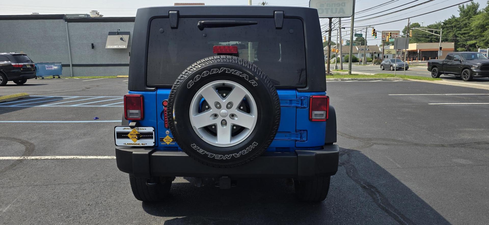 2016 Blue /Charcoal Jeep Wrangler Unlimited Sport 4WD (1C4BJWDG3GL) with an 3.6L V6 DOHC 24V FFV engine, 5-Speed Automatic transmission, located at 1010 N White Horse Pike, Stratford, NJ, 08084, (856) 262-9500, 39.838921, -75.011497 - Photo#5