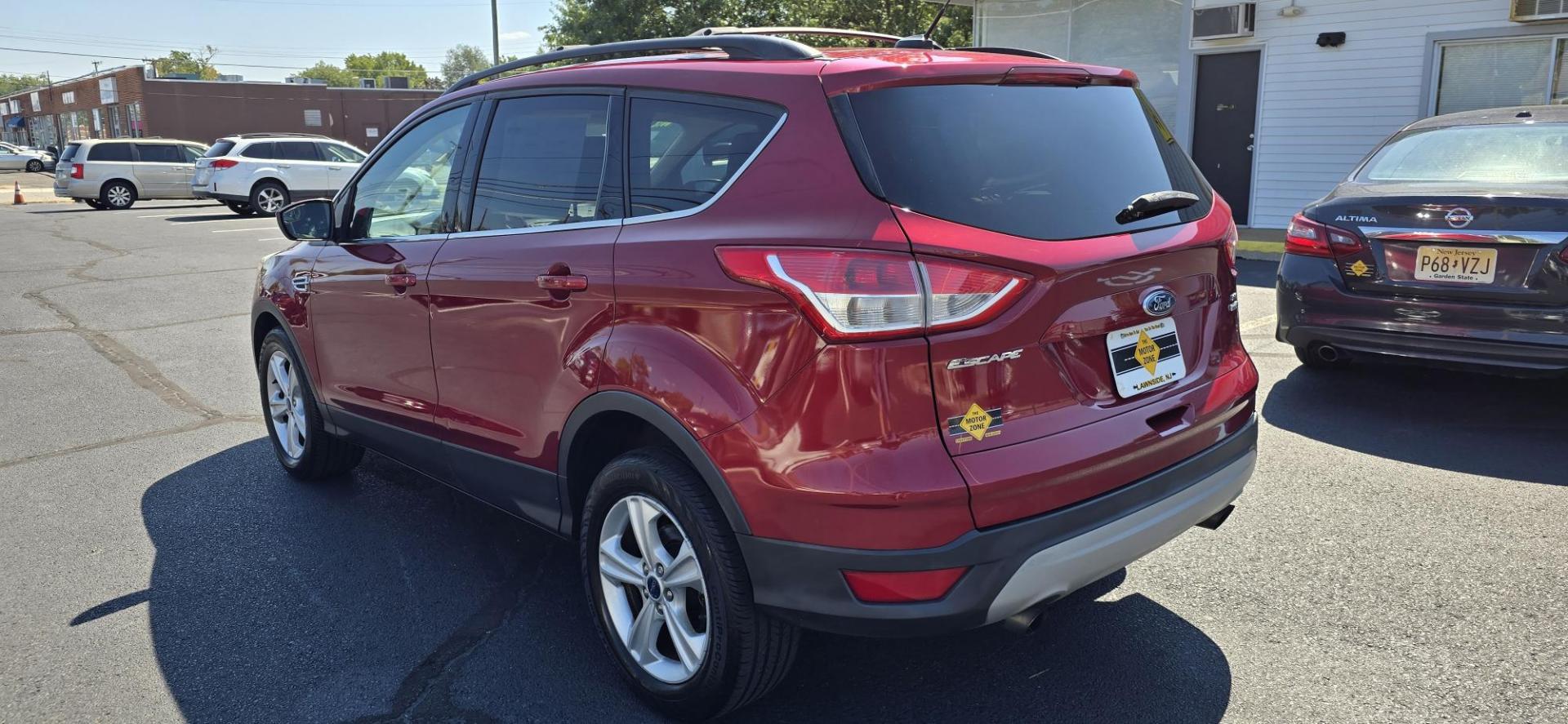 2013 Red /Tan Ford Escape SE AWD (1FMCU9GX0DU) with an 1.6L L4 DOHC 16V engine, 6-Speed Automatic transmission, located at 1010 N White Horse Pike, Stratford, NJ, 08084, (856) 262-9500, 39.838921, -75.011497 - Photo#2