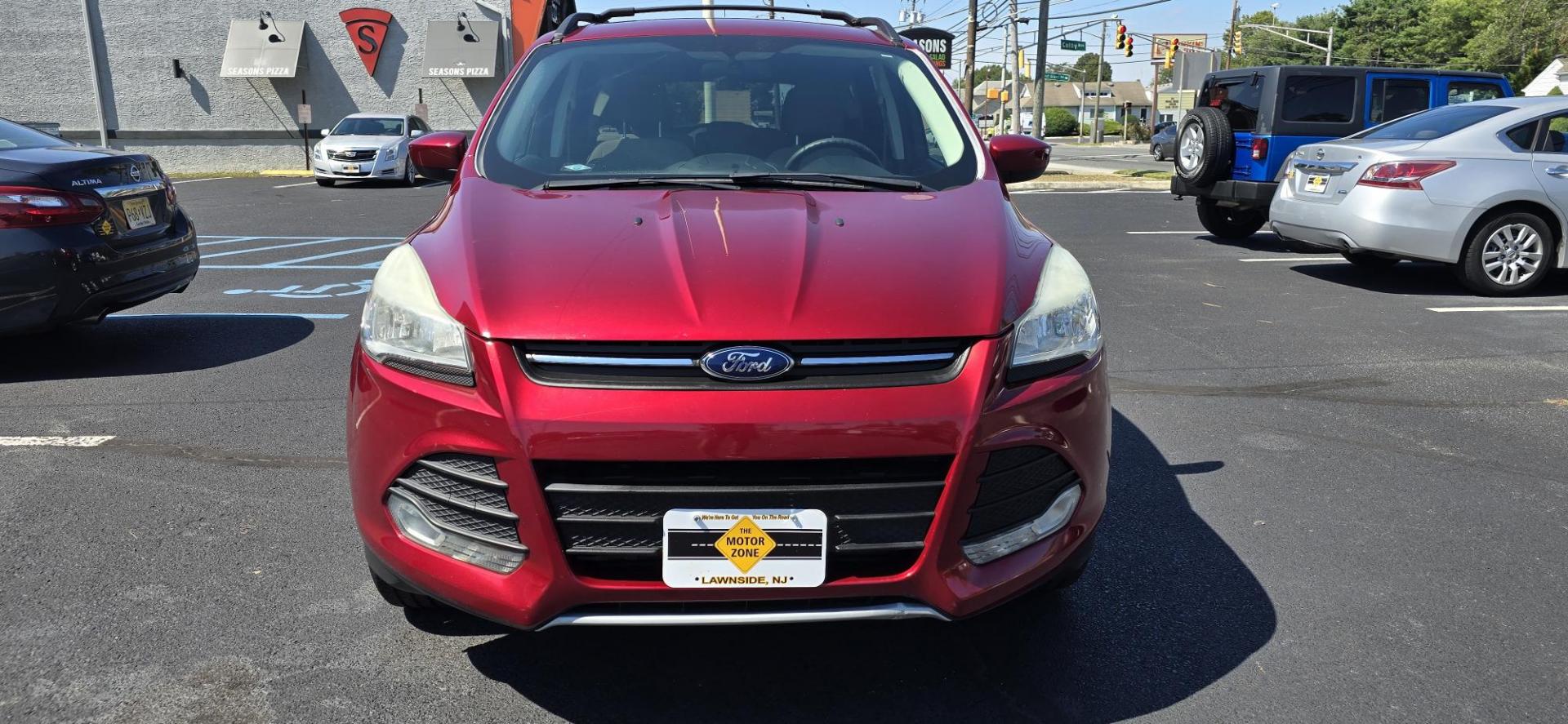 2013 Red /Tan Ford Escape SE AWD (1FMCU9GX0DU) with an 1.6L L4 DOHC 16V engine, 6-Speed Automatic transmission, located at 1010 N White Horse Pike, Stratford, NJ, 08084, (856) 262-9500, 39.838921, -75.011497 - Photo#6