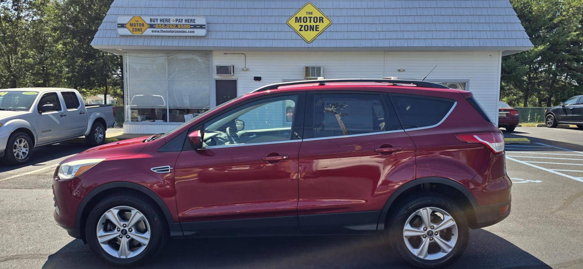 2013 Red /Tan Ford Escape SE AWD (1FMCU9GX0DU) with an 1.6L L4 DOHC 16V engine, 6-Speed Automatic transmission, located at 1010 N White Horse Pike, Stratford, NJ, 08084, (856) 262-9500, 39.838921, -75.011497 - Photo#5