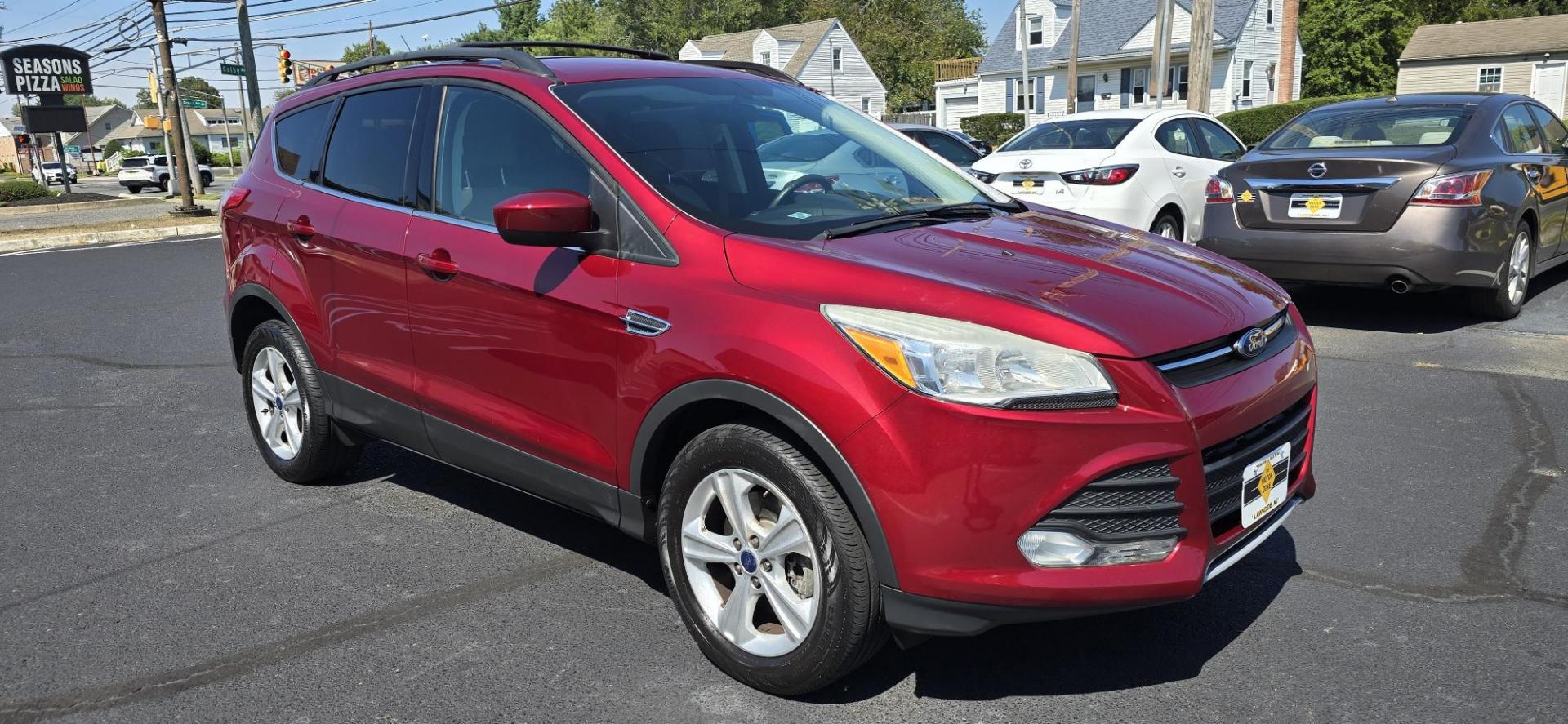 2013 Red /Tan Ford Escape SE AWD (1FMCU9GX0DU) with an 1.6L L4 DOHC 16V engine, 6-Speed Automatic transmission, located at 1010 N White Horse Pike, Stratford, NJ, 08084, (856) 262-9500, 39.838921, -75.011497 - Photo#1