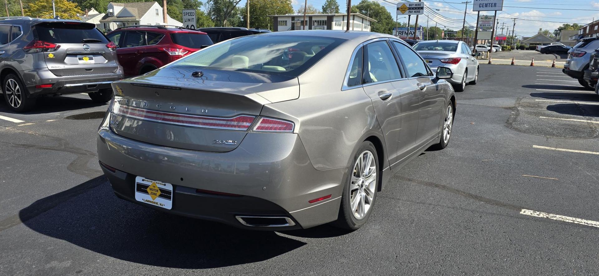 2015 Gray /Tan Lincoln MKZ AWD (3LN6L2J93FR) with an 2.0L L4 DOHC 16V engine, 6-Speed Automatic transmission, located at 1010 N White Horse Pike, Stratford, NJ, 08084, (856) 262-9500, 39.838921, -75.011497 - Photo#2