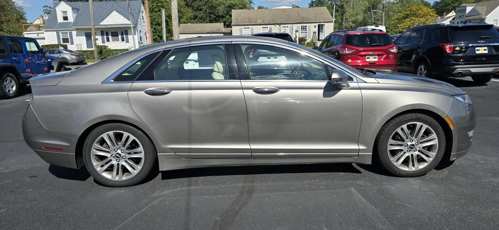 2015 Gray /Tan Lincoln MKZ AWD (3LN6L2J93FR) with an 2.0L L4 DOHC 16V engine, 6-Speed Automatic transmission, located at 1010 N White Horse Pike, Stratford, NJ, 08084, (856) 262-9500, 39.838921, -75.011497 - Photo#5