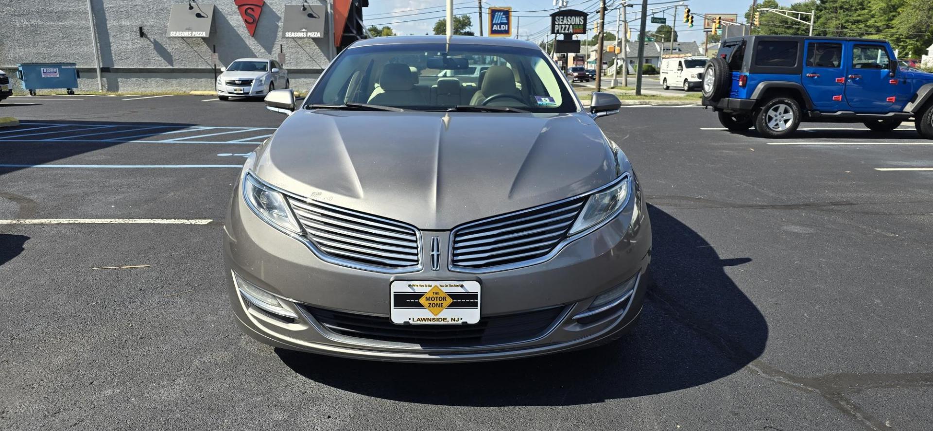 2015 Gray /Tan Lincoln MKZ AWD (3LN6L2J93FR) with an 2.0L L4 DOHC 16V engine, 6-Speed Automatic transmission, located at 1010 N White Horse Pike, Stratford, NJ, 08084, (856) 262-9500, 39.838921, -75.011497 - Photo#6
