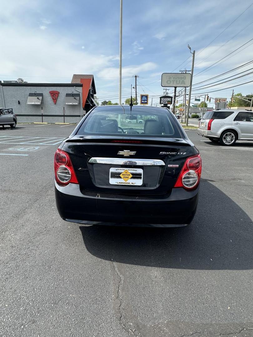 2014 Black /Black Chevrolet Sonic LTZ Auto Sedan (1G1JE5SB8E4) with an 1.4L L4 DOHC 24V TURBO engine, 6-Speed Automatic transmission, located at 1010 N White Horse Pike, Stratford, NJ, 08084, (856) 262-9500, 39.838921, -75.011497 - Photo#5