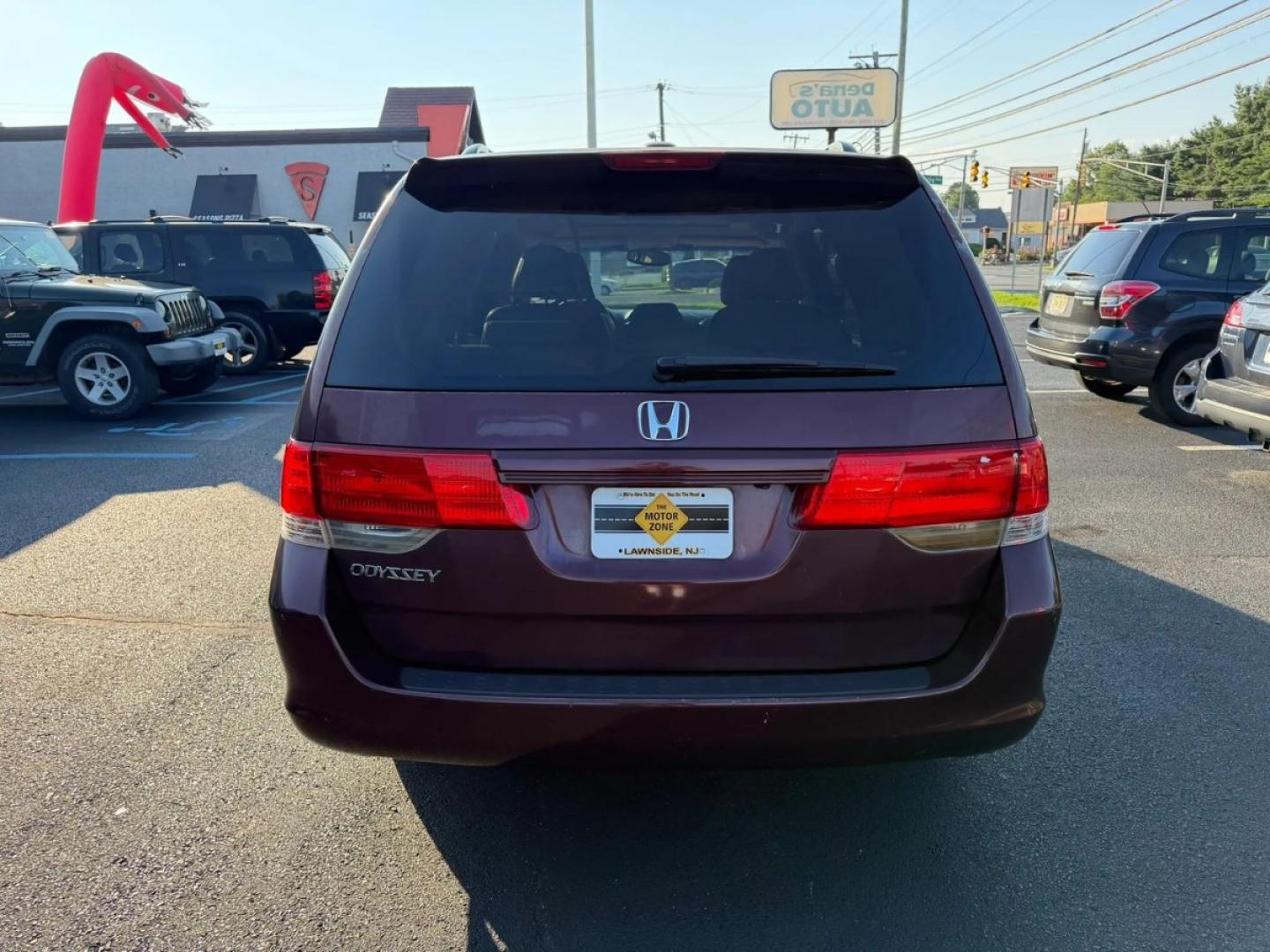 2010 Maroon /Beige Honda Odyssey EX-L w/ DVD (5FNRL3H79AB) with an 3.5L V6 SOHC 24V engine, 5A transmission, located at 1010 N White Horse Pike, Stratford, NJ, 08084, (856) 262-9500, 39.838921, -75.011497- Photo#4