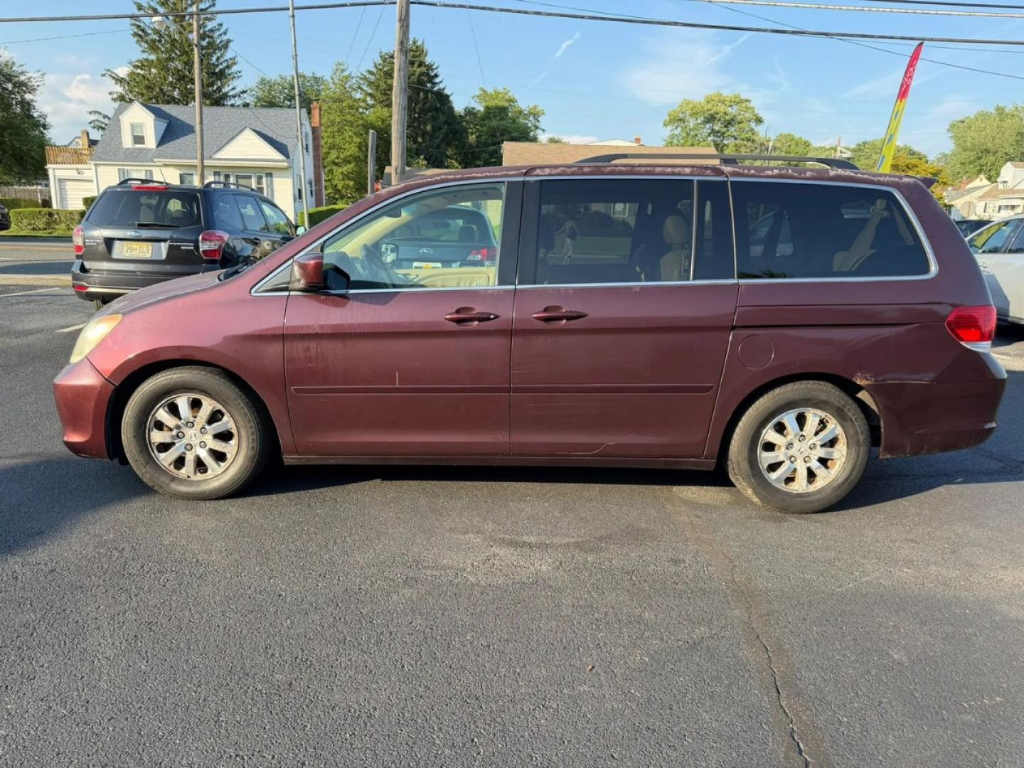 2010 Maroon /Beige Honda Odyssey EX-L w/ DVD (5FNRL3H79AB) with an 3.5L V6 SOHC 24V engine, 5A transmission, located at 1010 N White Horse Pike, Stratford, NJ, 08084, (856) 262-9500, 39.838921, -75.011497- Photo#3