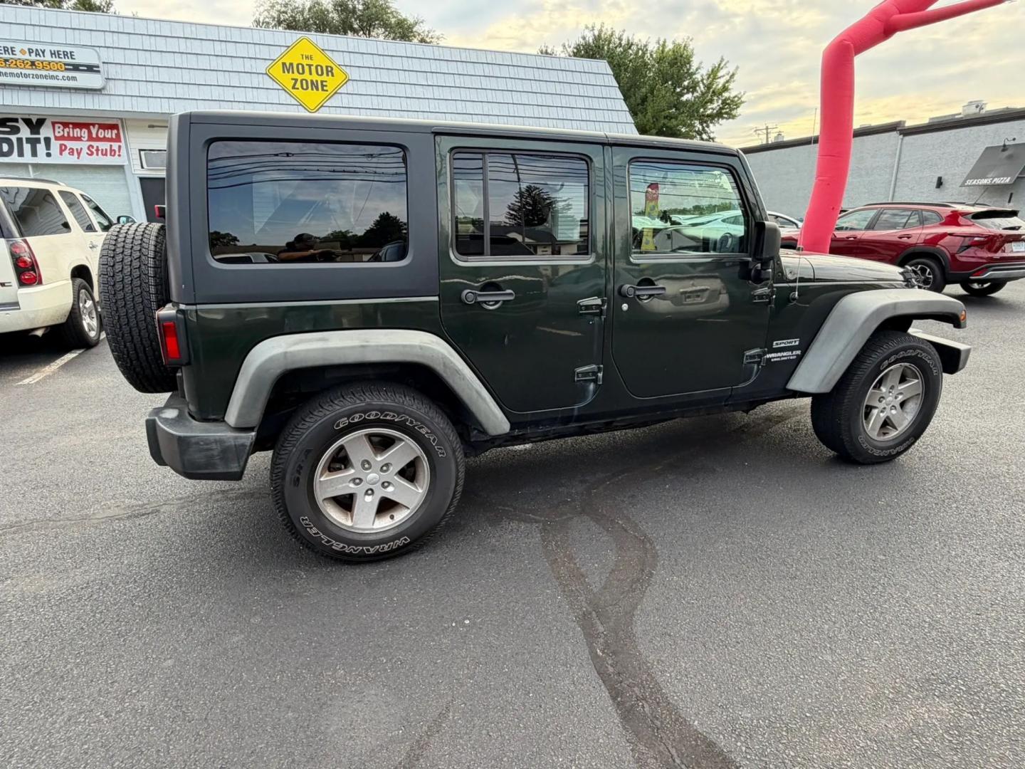 2012 Jeep Wrangler Unlimited Sport 4WD (1C4BJWDG4CL) with an 3.6L V6 DOHC 24V FFV engine, located at 1010 N White Horse Pike, Stratford, NJ, 08084, (856) 262-9500, 39.838921, -75.011497- Photo#1